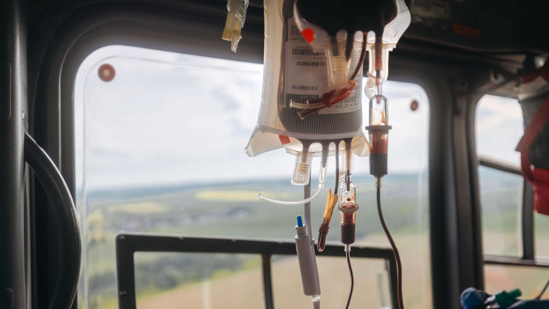 Blood transfuion being administered onboard ae EMS helicopter